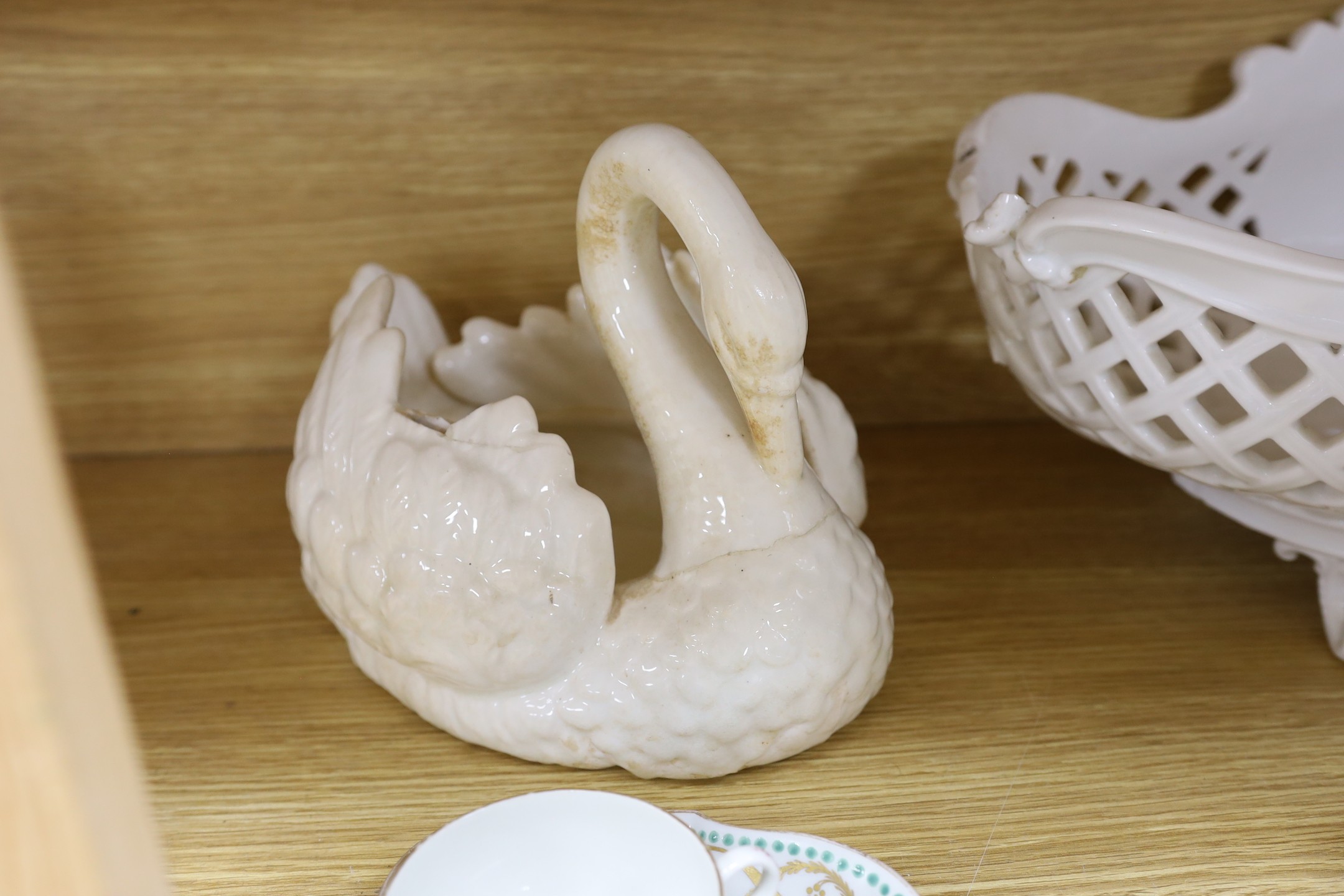 A group of Staffordshire blue and white pottery, including a sauce tureen and cover, together with a selection of decorative tea and dessert wares and ceramic centrepieces, one modelled as a cockerel